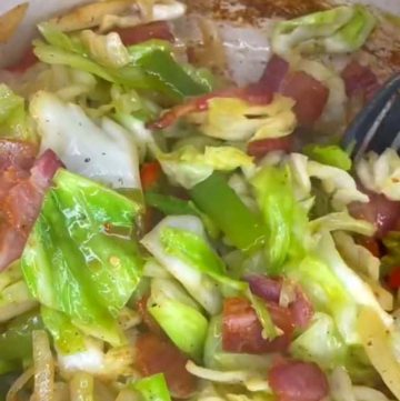 Fried cabbage with bacon onion and garlic