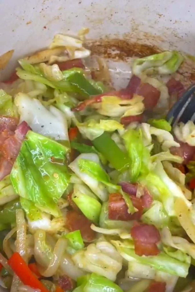 Fried cabbage with bacon onion and garlic